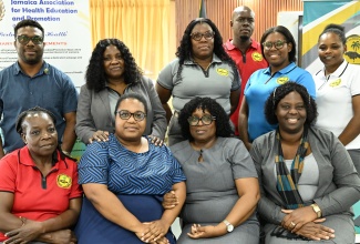 Newly elected president of the Jamaica Association of Health Education and Promotion (JAHEP), Dahlia Gayle Reid (second left, seated) shares a moment with the new executive during the organisation