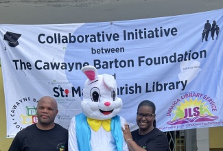Senior Librarian at the St. Mary Parish Library, Kereen Burton (right) is with Christopher Barton (left) of Cawayne Barton Foundation.  Occasion was the fifth staging of the St. Mary Parish Library Kite Festival, hosted in partnership with the Cawayne Barton Foundation recently, on the grounds of the Claude Stewart Park in Port Maria.