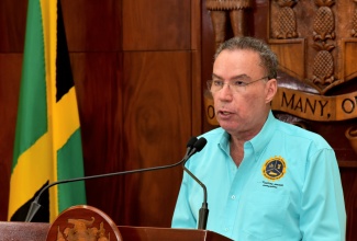 Minister of Energy, Transport,  and Telecommunications, Hon. Daryl Vaz, addresses a post-Cabinet press briefing, held at Jamaica House on April 15.

