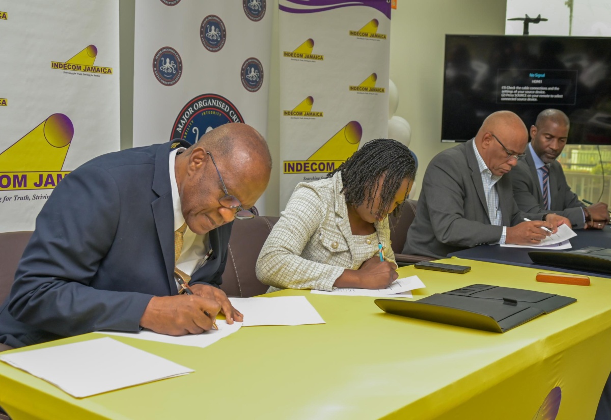 Independent Commission of Investigations (INDECOM) Commissioner, Hugh Faulkner (left), and (from second left) INDECOM’s Deputy Commissioner, Yanique Taylor Wellington; Director-General at the Major Organised Crime and Anti-Corruption Agency (MOCA), Colonel Desmond Edwards; and Head of Legal and Prosecutorial Services at MOCA, Nigel Parke, sign a Memorandum of Understanding (MOU) to formalise INDECOM and MOCA’s partnership. The MOU was signed during a ceremony at MOCA’s headquarters at NCB Towers in Kingston on Monday (April 20).
