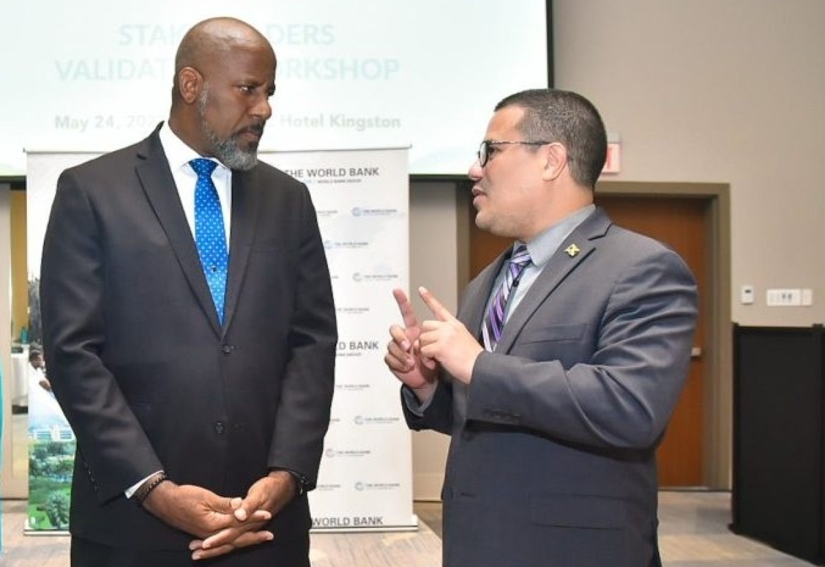 Minister of Water, Environment and Climate Change, Hon. Matthew Samuda (right), is in discussion with Director General of the Planning Institute of Jamaica (PIOJ), Dr. Wayne Henry, during the recent opening ceremony for the Jamaica Blue Economy Framework Project stakeholders’ validation workshop held at AC Hotel by Marriott in St. Andrew.
