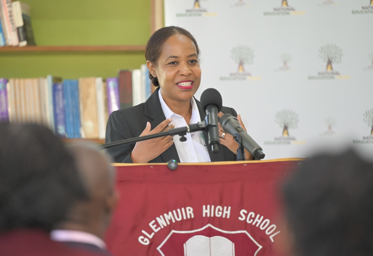 Director of Donor and Partnership Management at the National Education Trust (NET), Keisha Johnson, addresses a recent cheque handover ceremony at Glenmuir High School in Clarendon.
