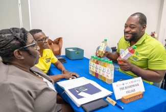 Representative of Guinea Hen Wata, Kami-Dale Cross (right), in discussion with representatives from the Boardwalk Village during a previous staging of the annual Speed Networking event, hosted by the Tourism Linkages Network at the Montego Bay Convention Centre, in St. James.

