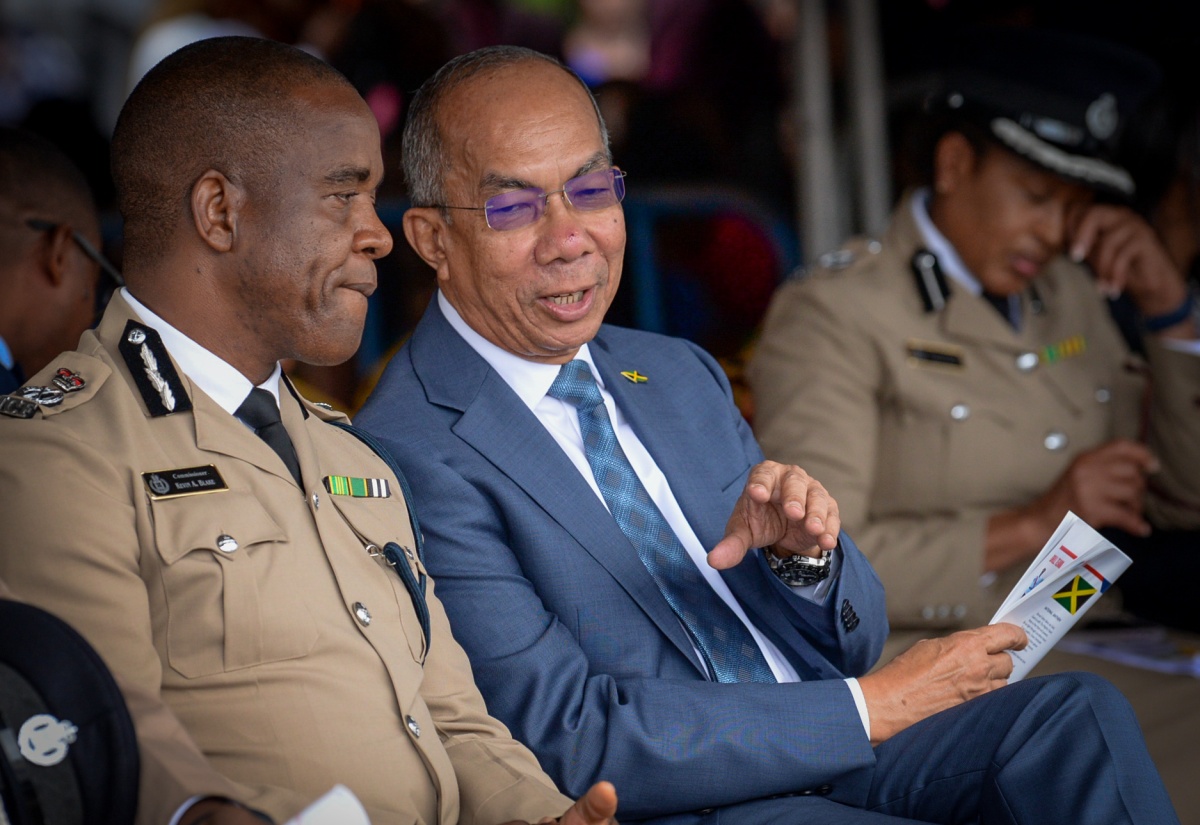 Deputy Prime Minister and Minister of National Security and Peace, Hon. Dr. Horace Chang (right), converses with Police Commissioner, Dr. Kevin Blake, during a Passing Out Parade for Jamaica Constabulary Force (JCF) recruits at the National Police College of Jamaica in St. Catherine.
