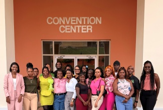 Beneficiaries of the 2025-2026 R.E.A.P. Entrepreneurship Conference, coordinated by the PIOJ’s Community Renewal Programme and implemented by Young Women and Young Men of Purpose (YWOP/YMOP). At  left is CEO & Founder of YWOP/YMOP, Lanisia Rhoden, and at right is Programme Coordinator, YWOP/YMOP, Toni-Ann Williams.

