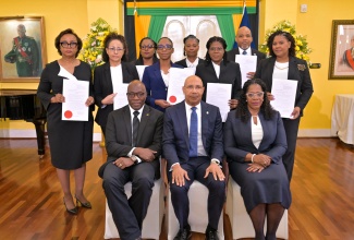Governor-General, His Excellency the Most Hon. Sir Patrick Allen (seated, centre); Chief Justice,  Hon. Bryan Sykes (seated, left) and President of the Court of Appeal, Hon. Justice Marva McDonald-Bishop (seated, right) share a photo with the eight members of the judiciary who were sworn into higher offices during a ceremony at King’s House in St. Andrew, today (April 9).
