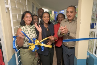 Minister of Health and Wellness, Dr. the Hon. Christopher Tufton (right) leads in celebrating the reopening of the retrofitted and upgraded dental unit at the Bellefield Health Centre in Manchester on April 17. Others pictured (from left) are Director of Grey Orthodontics, Dr. Susan Grey, Member of Parliament for Manchester Central, Hon. Rhoda Moy Crawford, and Parish Manager for Manchester Health Services, Sadia Chambers-Ferguson.