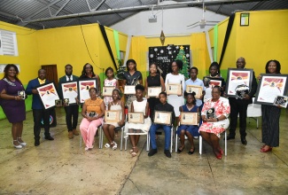 Outstanding students and educators display their awards during the Friends of Region 6 awards ceremony held in December 2025 at the Old Harbour High School in St. Catherine.
