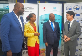 Minister of Industry, Investment and Commerce, Senator the Hon. Aubyn Hill (second right), converses with (from left) Acting Chief Executive Officer of the Jamaica Business Development Corporation (JBDC), Harold Davis; United Nations Industrial Development Organisation (UNIDO) National Project Coordinator, Sanatty Holness-Plummer, and Ambassador of Japan to Jamaica, His Excellency Kohei Maruyama. The occasion was the Call for Applications Launch for the Industrial Development and Technology Transfer among the Member States of the Caribbean Community (CARICOM) project, held on Thursday (April 16) at the JBDC Incubator and Resource Centre (IRC) in Kingston.