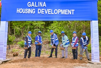 Prime Minister, Dr. the Most Hon. Andrew Holness (third left); and Minister without Portfolio in the Ministry of Economic Growth and Infrastructure Development with responsibility for Land Titling and Settlements and Member of Parliament for St. Mary Western, Hon. Robert Montague (third right), lead the symbolic groundbreaking for the Galina Housing Development in the parish on Friday (April 24). They are joined by, (from left), Vice General Manager, Henan Fifth Construction Group, Zitao Wang; Chairman, National Housing Trust (NHT), Linval Freeman; Chinese Ambassador, His Excellency Wang Jinfeng; and Managing Director, NHT, Martin Miller.