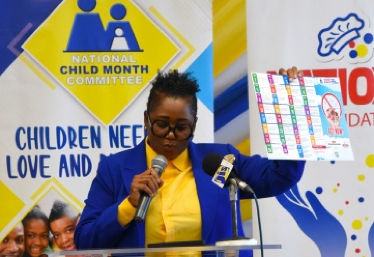 National Child Month Committee (NCMC) Chair, Nicole Patrick-Shaw, displays the calendar of events during the launch of Child Month last year.
