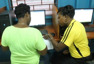 A jobseeker completes an application form at a previous job fair hosted by the Ministry of Labour and Social Security.
