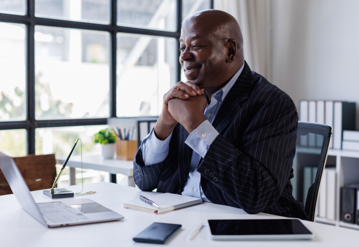 Picture of senior male using a computer in an office 