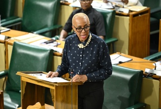 Minister of Finance and the Public Service, Hon. Fayval Williams, speaks in the House of Representatives on May 19.