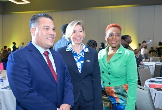 Minister of Water, Environment and Climate Change, Hon. Matthew Samuda (left), at the Manufacture 360° Conference hosted by the Jamaica Manufacturers and Exporters Association (JMEA), held at the AC Marriott Hotel on May 20 under the theme ‘Robust Recovery for Resilient Growth’. He is photographed with JMEA President, Kathryn Silvera (centre), and JMEA Executive Director, Kamesha Turner Blake.