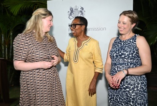 British High Commissioner to Jamaica, Her Excellency Alicia Herbert (centre), engages in discussion with Project Lead, Partnership for Atlantic Slavery Scholarship, Archiving and Global Exchange (PASSAGE) at the National Archives, Philippa Hellawell (left), and Head of Research, Interpretation, and Engagement, Lloyd’s Register Foundation, Louise Sanger, during the PASSAGE International Research Mobility Programme launch at the Windrush Gardens, British High Commission in Kingston on Wednesday (May 27).