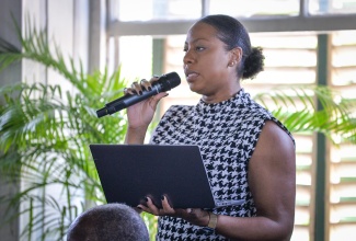 Parish Manager for the Social Development Commission (SDC) in St. Catherine, Shana-Lee Archibald, speaks at the monthly meeting of the St. Catherine Municipal Corporation, on May 14, in Spanish Town.