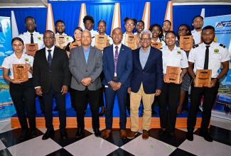 Recipients under the Airports Authority of Jamaica (AAJ)  Aviation Scholarships Programme, show off plaques presented at the awards ceremony held on Thursday (May 7) at the Terra Nova All-Suite Hotel in St. Andrew.  They are joined by (from second left, front row) AAJ President, Audley Deidrick, Deputy Director General, Regulatory Affairs, AAJ, Rohan Campbell; AAJ President, Audley Deidrick; President, Caribbean Maritime University (CMU), Professor Andrew Spencer; and Chairman, AAJ, Douglas Lindo.
