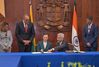 Minister of Foreign Affairs and Foreign Trade, Senator the Hon. Kamina Johnson Smith (seated, left) and India’s Minister of External Affairs, His Excellency Dr. Subrahmanyam Jaishankar (seated, right), sign a memorandum of understanding (MOU) for cooperation between India and Jamaica. Witnessing the signing (from left) are:Minister of Education, Skills, Youth and Information, Senator Dr. the Hon. Dana Morris Dixon; Minister of Health & Wellness, Dr the Hon. Christopher Tufton; and Indian High Commissioner to Jamaica, His Excellency Mayank Joshi. The signing followed bilateral discussions at Jamaica House in Kingston on Monday (May 4).
