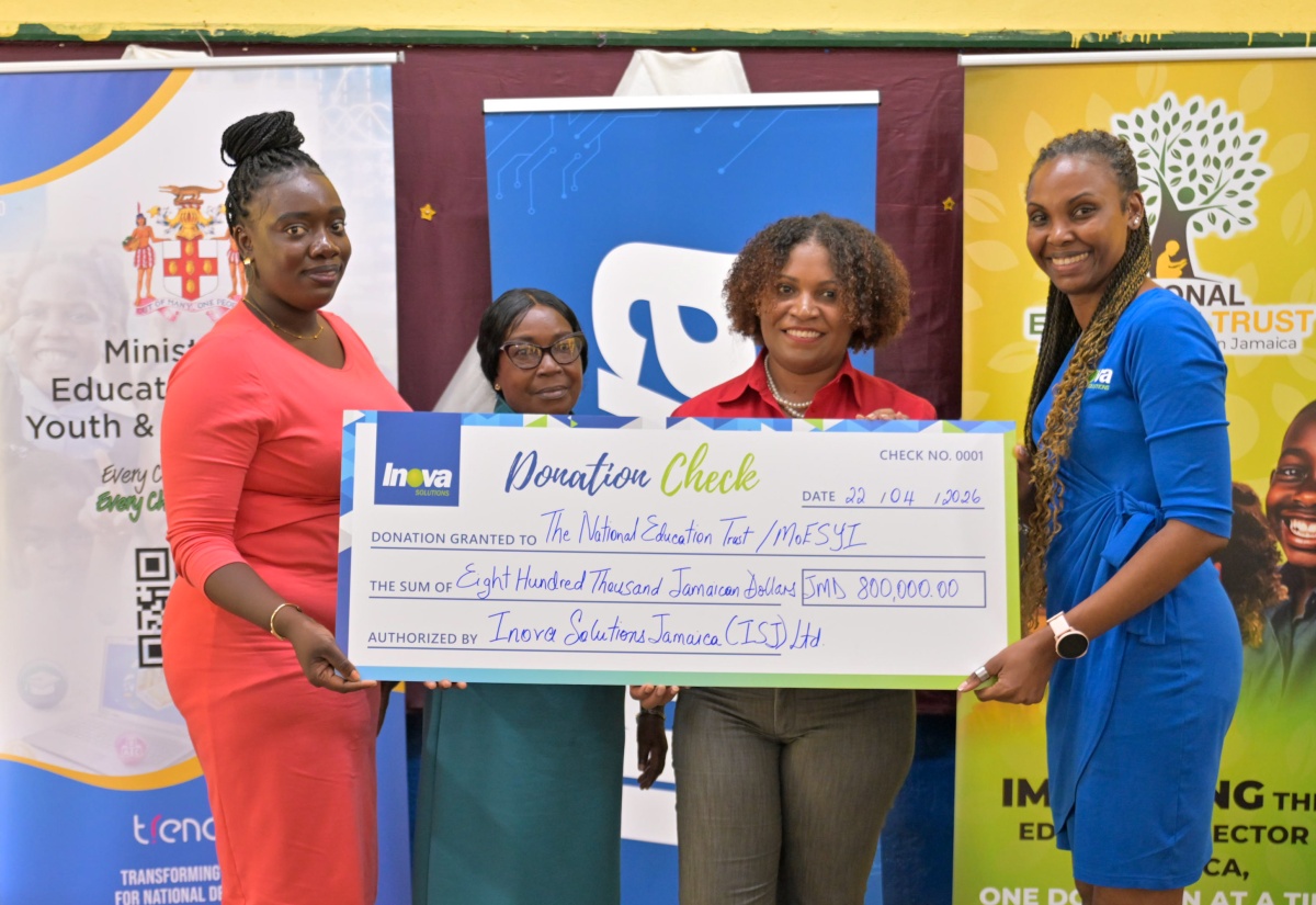  Executive Director of the National Education Trust (NET), Latoya Harris-Ghartey (second right), joins Country Manager for Inova Solutions Jamaica, Kiefa Gay Sandcroft (right), in handing over a cheque for $800,000 to benefit teachers in Manchester and St. Elizabeth. Accepting the donation are Teacher of the St. Elizabeth-based Merrywood Primary School, Shanor Bailey (left), and Principal, Marva McKinnon. The recent presentation ceremony took place at Bethany Primary School in Manchester.