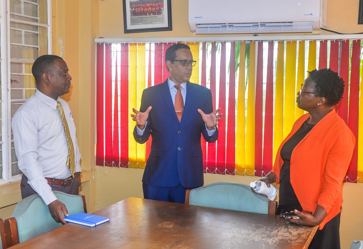 Pro-Registrar and Deputy Chief Executive Officer, Caribbean Examinations Council (CXC), Dr. Eduardo Ali (centre), is in discussion with Principal of the St. Catherine-based Dinthill Technical High School, Anthony Garwood (left), and Head of the Mathematics Department at the school, Petrona Hemans-Mighty, during a visit to the institution on May 12 to observe the pilot of the Caribbean Targeted Education Certificate (CTEC) Mathematics Module One.
