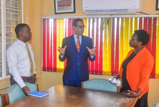 Pro-Registrar and Deputy Chief Executive Officer, Caribbean Examinations Council (CXC), Dr. Eduardo Ali (centre), is in discussion with Principal of the St. Catherine-based Dinthill Technical High School, Anthony Garwood (left), and Head of the Mathematics Department at the school, Petrona Hemans-Mighty, during a visit to the institution on May 12 to observe the pilot of the Caribbean Targeted Education Certificate (CTEC) Mathematics Module One.

