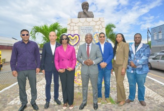 Minister of Labour and Social Security, Hon. Pearnel Charles Jr. (centre), is joined by several key stakeholders for the Aggie Bernard Official Wreath-Laying Ceremony at the Aggie Bernard Monument, located at the Craft Market on Port Royal Street in downtown Kingston on Thursday (May 21). From left are Councillor for the Whitfield Town Division, Eugene Kelly, who represented Mayor of Kingston, Councillor Andrew Swaby; President, Jamaica Employers