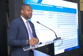 Director General, Office of Disaster Preparedness and Emergency Management (ODPEM), Commander Alvin Gayle, addresses the National Disaster Risk Management Council meeting at the Office of the Prime Minister in St. Andrew, on May 27.