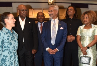 Minister of Foreign Affairs and Foreign Trade, Senator the Hon. Kamina Johnson Smith (left), shares in light conversation with Minister of External Affairs of the Republic of India, His Excellency Dr. Subrahmanyam Jaishankar (third, right) ahead of a welcome dinner at the Terra Nova All-Suite Hotel in Kingston on Sunday (May 3). They are flanked by (from left) Minister of Tourism, Hon. Edmund Bartlett; Minister of Industry, Investment and Commerce, Hon. Aubyn Hill; Chief Executive Officer of Amber Group, Dushyant Savadia; and Minister of Education, Skills, Youth and Information, Senator Dr. the Hon. Dana Morris Dixon.
