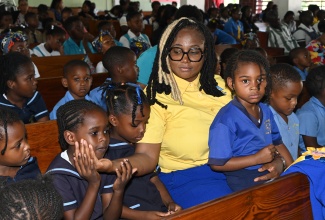 Chair of the National Child Month Committee, Nicole Patrick-Shaw, interacts with children during  the National Day of Prayer for Children and their families, on Wednesday, May 20, at the International Church of the Foursquare Gospel Jamaica, 15 Cassia Park Road, Kingston.             

