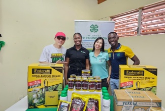 Mighty Crown’s Masta Simon (left), from Japan, hands over donation to Projects Officer for Jamaica 4-H Clubs St. Ann branch, Tanika Allen (second left); Head of LINK UP JAJA, Natsumi Nagamura (third left); and Parish Manager for the Jamaica 4-H Clubs, St. Ann branch, Tedroy Gordon, at the Social Development Commission Parish Office in Brown’s Town, St. Ann, on Thursday, May 14.
