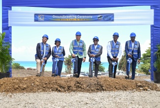 Prime Minister, Dr. the Most Hon. Andrew Holness (third left), and National Housing Trust (NHT) Chairman, Linval Freeman (third right), break ground for the Rozelle Estate development in St. Thomas on May 8. Also participating are (from left) Member of Parliament for St. Thomas Western, James Robertson; Director of New Rozelle Properties Limited, Diandra Bramwell; NHT Managing Director, Martin Miller; and New Rozelle Properties Limited Chairman, John Sinclair.
