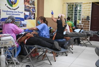 Dentists provide free dental care to a resident of Gayle at the Gayle Civic Centre in St. Mary on May 13. Services were offered through the Great Shape! Inc. Sealant Dental Programme and made possible by the Sandals Foundation in partnership with the Ministry of Health and Wellness. 
