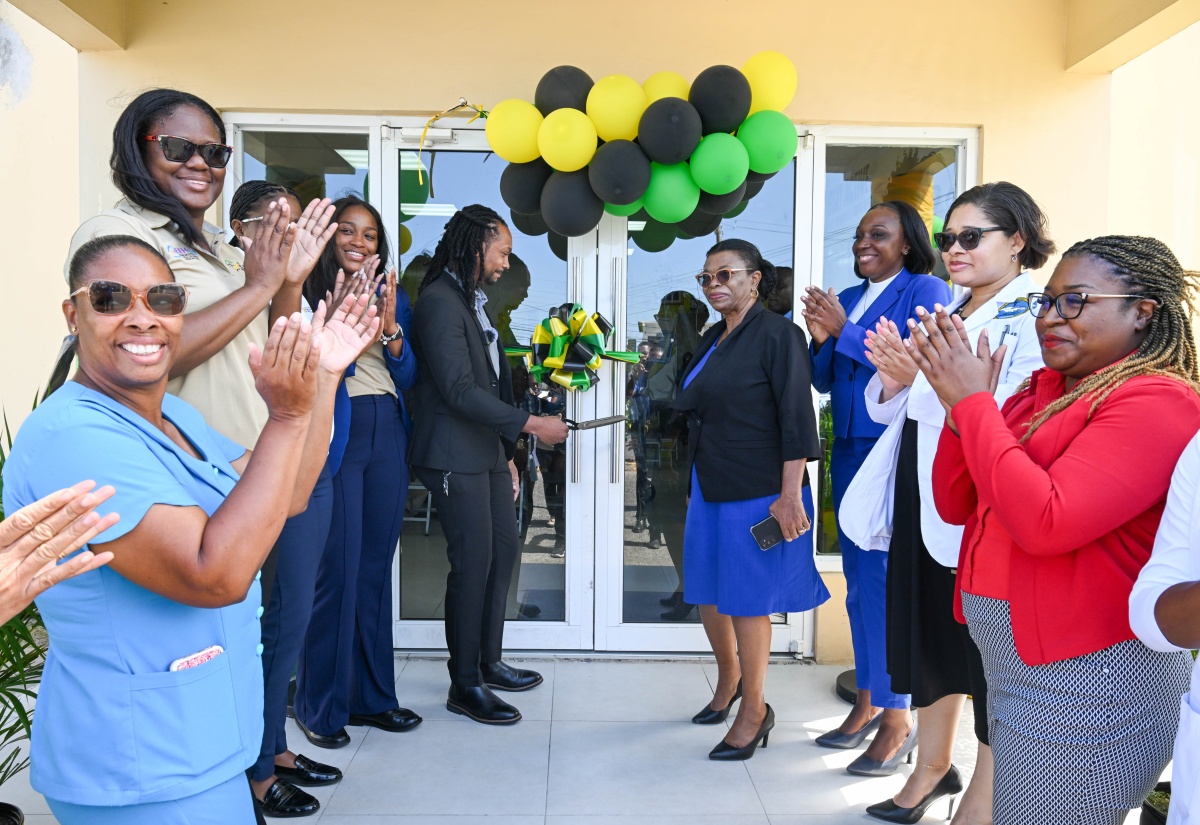 Principal Director for Enabling Environment in Health and Client Services in the Ministry of Health and Wellness, Dr. Kimorley Humphrey (centre), and Parish Manager for Portland Health Services, Joan McPherson (fourth right), lead the ribbon-cutting exercise to mark the launch of the Ministry