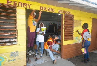 Volunteers participate in painting and renovation activities at Ferry Basic School in St. Andrew on Labour Day (May 25) as part of enhancement works being carried out by the Urban Development Corporation (UDC) and its partners to improve the institution’s learning environment. The project included roof repairs, kitchen reconstruction, landscaping, and general infrastructural upgrades.