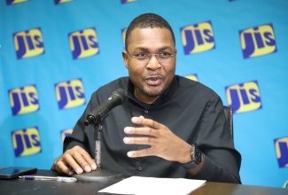 Minister without Portfolio in the Ministry of Economic Growth and Infrastructure Development with responsibility for Works, Hon. Robert Morgan, addresses a JIS Think Tank on the SPARK Programme.
