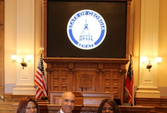 Jamaica’s Ambassador to the United States, His Excellency Major General (Ret’d) Antony Anderson, receives a Georgia State Senate resolution from State Senator, Tonya Anderson, during a ceremony at the State Capitol on May 4. At left is Jamaica’s Honorary Consul in Atlanta, Dr. Elaine Grant Bryan.