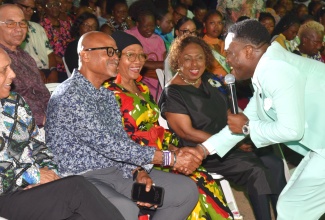 Gospel artiste, Calvin Curtis Whilby (standing), popularly known as ‘Prodigal Son