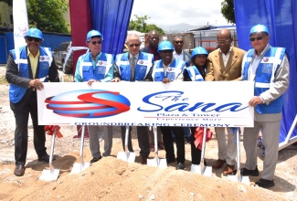Science, Energy, Telecommunications and Transport Minister, Hon. Daryl Vaz, participates in the breaking of ground for the US$25 million SANA commercial development on Thursday (May 28) at the South Avenue site in Kingston. He is joined by (from left), Chairman of Money Masters Real Estate and Infrastructure Investments Limited (MMREIF), Michael McNaughton; Former Prime Minister, Bruce Golding; Chairman of Money Masters- REIF South Development Limited, Ewan Straw; President of Money Masters Limited, Claudette Crooks; Investor, Adolph Stamp; and Justice and Constitutional Affairs Minister, Hon. Delroy Chuck.
