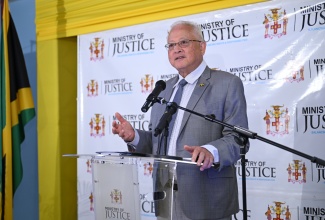 Minister of Justice and Constitutional Affairs, Hon. Delroy Chuck, addresses Wednesday