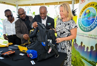 Deputy Director General, Sustainable Development and Social Planning, Planning Institute of Jamaica, Claire Bernard (left); Executive Director, Jamaica National Heritage Trust, Dr. Leslie Harrow (second left); Chief Executive Officer/Government Town Planner, National Environment and Planning Agency, Leonard Francis and Ambassador, European Union to Jamaica, Her Excellency, Dr. Erja Askola, examining some of the equipment officially over on Thursday (May 14) to the Mason River Protected Area in Clarendon.