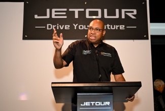 State Minister in the Ministry of Industry, Investment and Commerce, Hon. Delano Seiveright (left), addresses the Jetour Jamaica official launch and media viewing at the Jetour Showroom on Merrivale Avenue in Kingston on May 24.