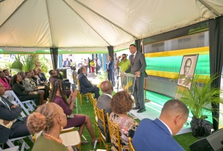 Prime Minister, Dr. the Most Hon. Andrew Holness, addresses yesterday’s (May 26), ceremony for the renaming of the Ministry of Labour and Social Security building, located at 14 National Heroes Circle in Kingston, in honour of the late former Minister of Labour and National Insurance, Lynden Newland.
