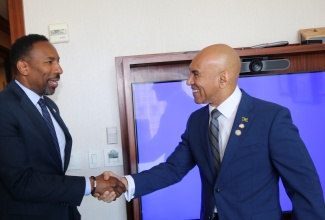Jamaica’s Ambassador to the United States, His Excellency Major General (Ret’d) Antony Anderson (right), greets Atlanta Mayor, André Dickens, upon arrival at the Buckhead Club in Atlanta on Sunday (May 3) for talks on deepening the Atlanta–Jamaica relationship in investment, trade and culture.