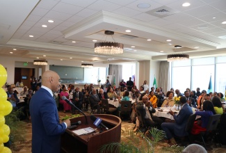 Jamaica’s Ambassador to the United States, His Excellency Major General (Ret’d) Antony Anderson, delivers the keynote address during the Elaine Bryan Foundation Inspirational Luncheon, held at the Buckhead Club in Atlanta on May 3.