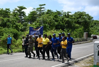 Law-enforcement officers in St. Thomas run with the
