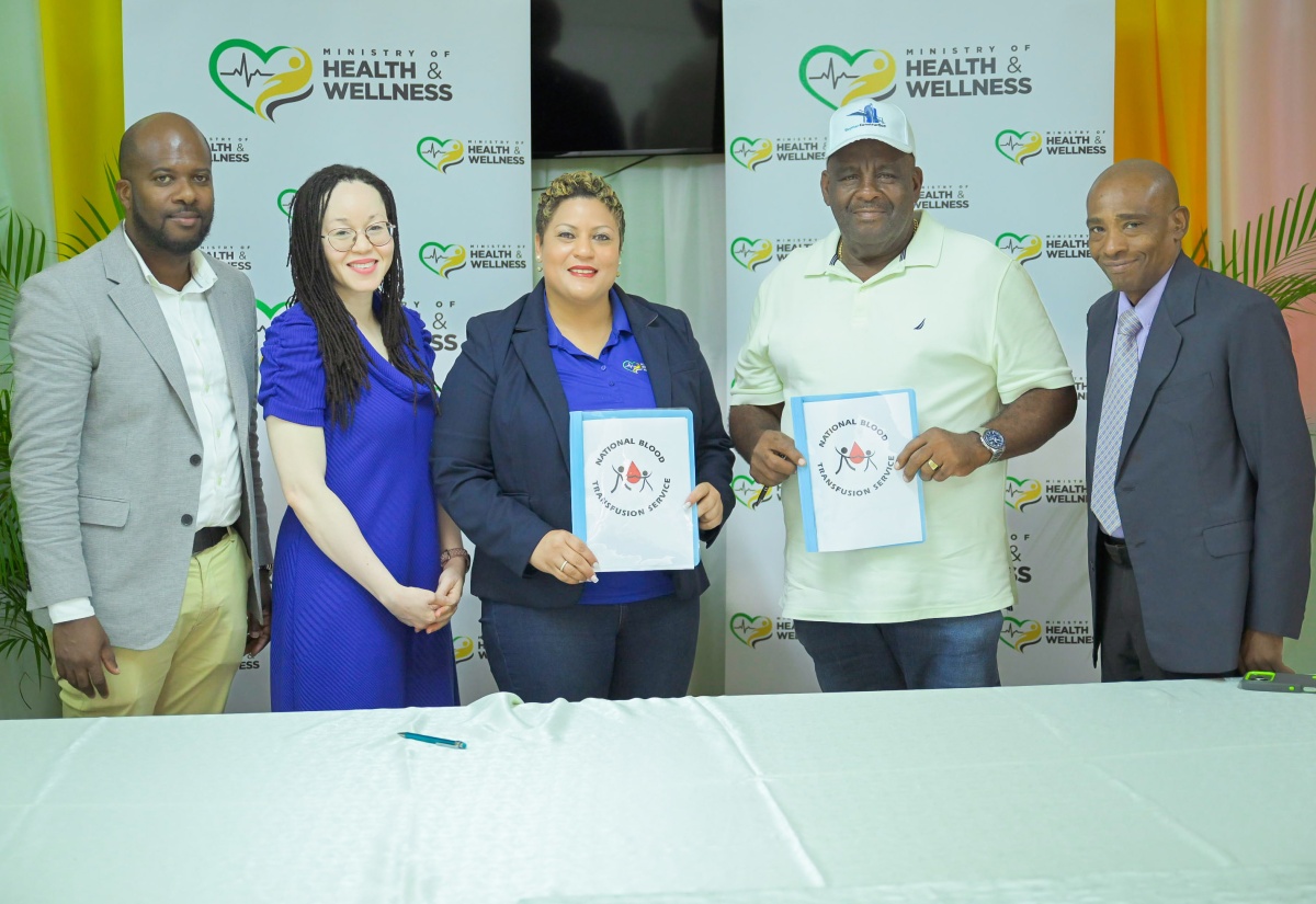Minister of State in the Ministry of Health and Wellness, Hon. Krystal Lee (third left), and Chief Executive Officer of Skymar Building Construction and Maintenance Limited, Leon Grant (fourth left), display a contract valued $15 million for a major refurbishment of the National Chest Hospital Blood Collection Centre in St. Andrew, during a signing ceremony held at the institution on May 8. Others pictured (from left) are Civil Engineer with the Ministry, Desmond Hines; Director of the National Blood Transfusion Service (NBTS), Kamille West-Mitchell, and Chief Executive Officer of the Hospital, Barrington Graham.
