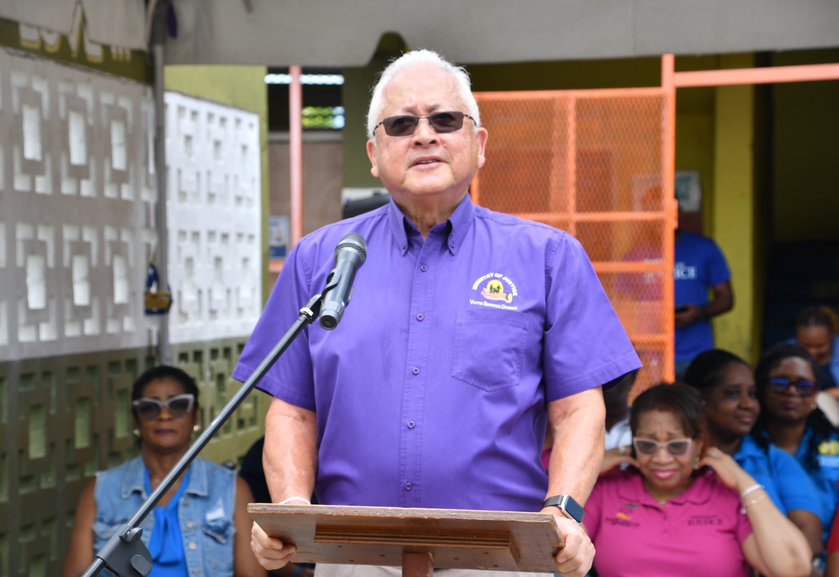 Minister of Justice and Constitutional Affairs, Hon. Delroy Chuck, addresses the reopening ceremony for the Reading Room at Catherine Hall Primary and Infant School in St. James, on May 20. 
