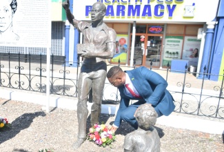Mayor of Montego Bay, Councillor Richard Vernon, lays a wreath at the monument of National Hero the Rt. Excellent Samuel Sharpe, during the annual floral tribute for the National Hero held in Sam Sharpe Square in Montego Bay, St. James on Saturday ( May 23).