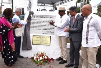 Minister of Culture, Gender, Entertainment and Sport, Hon. Olivia Grange (left), and Minister of Tourism, Hon. Edmund Bartlett (centre), applaud as Minister of External Affairs, India, Dr. S. Jaishankar (second left), unveils a commemorative plaque at the East Indian Migration Monument in Old Harbour Square, St. Catherine on Sunday (May 3). Sharing in the unveiling are High Commissioner of India to Jamaica, Mayank Joshi (second right); and Jamaica's High Commissioner to India, Jason Hall.